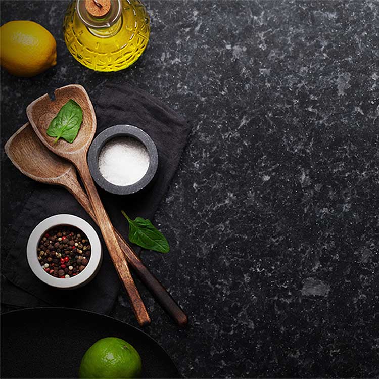 Angola Black granite worktops being used for cooking