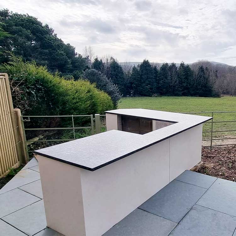 Large black granite outdoor kitchen worktop created for a garden in Hampshire by LBS Stone
